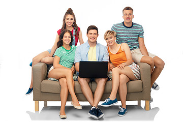 Image showing friends with laptop computer sitting on sofa