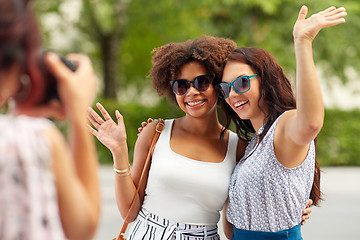 Image showing woman photographing her friends in summer