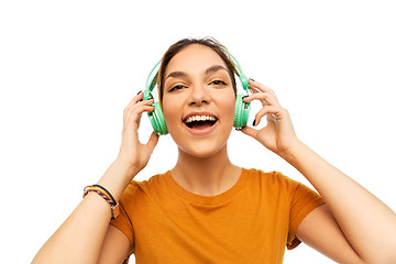 Image showing happy young woman or teenage girl with headphones