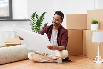 Image showing man with boxes and blueprint moving to new home