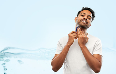 Image showing indian man shaving beard with razor blade