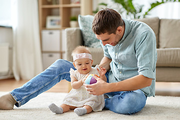 Image showing father and little baby daughter with ball at home