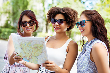 Image showing happy women with map on street in summer city