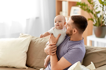 Image showing father with little baby girl at home