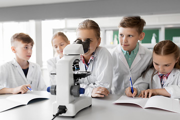 Image showing kids or students with microscope biology at school