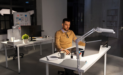 Image showing designer with computer and pen tablet at office