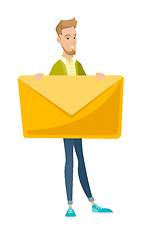 Image showing Young caucasian businessman holding big envelope.