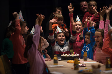 Image showing The young boy joyfully celebrating his birthday