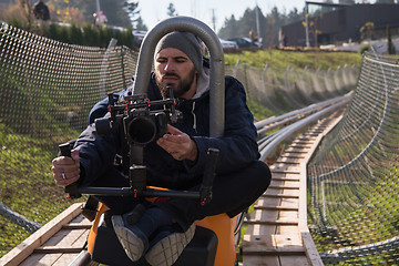 Image showing videographer at work on alpine coaster