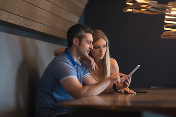 Image showing couple using tablet at home