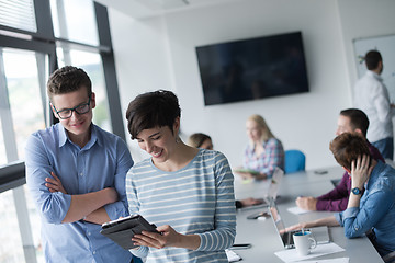 Image showing Two Business People Working With Tablet in office