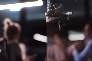 Image showing Multiethnic startup business team in night office