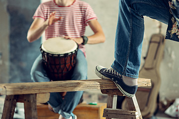 Image showing Repetition of rock music band. drummer behind the drum set.