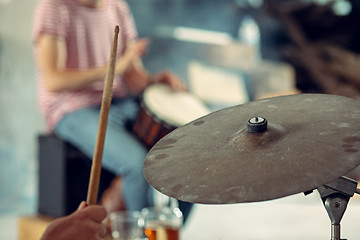 Image showing Repetition of rock music band. drummer behind the drum set.