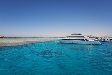 Image showing Luxury yacht docking near coral reef