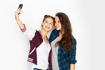 Image showing happy teenage girls taking selfie by smartphone