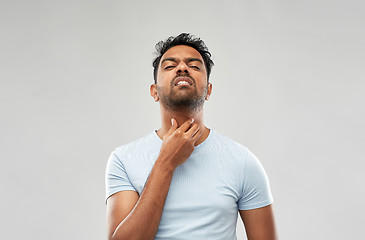 Image showing indian man suffering from neck pain or sore throat