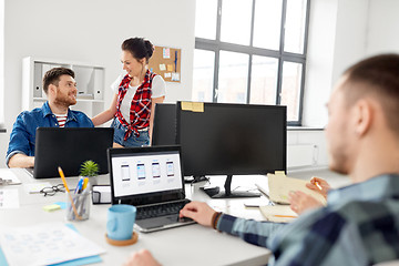 Image showing creative team working on user interface at office