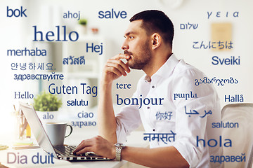 Image showing man with laptop over words in foreign languages