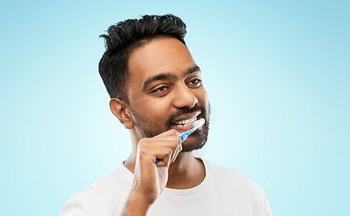 Image showing indian man with toothbrush cleaning teeth