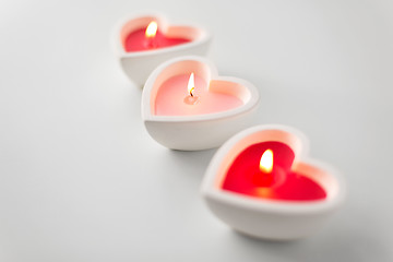 Image showing heart shaped candles burning on valentines day