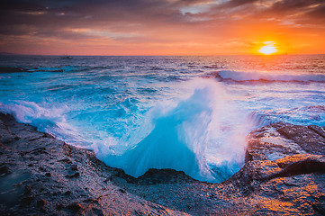 Image showing The whooosh of waves as they break over the coastal rocks