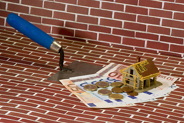 Image showing Trowel with money