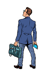 Image showing businessman with briefcase and phone. isolate on white background