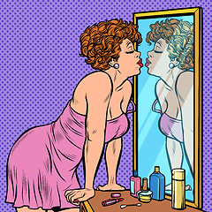 Image showing woman in nightgown kissing her reflection in the mirror