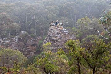 Image showing Female hiker in Blue Mountains on top of pagoda in mist and fog