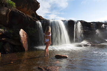 Image showing Female exploring and enjoying waterfalls and rock pools in nature