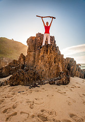 Image showing Energetic motivated woman fitness beach