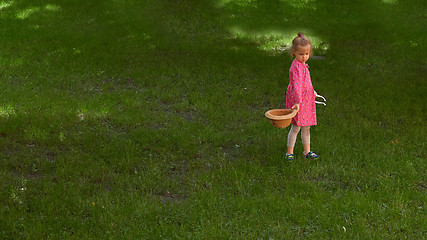 Image showing Little girl walking in the park