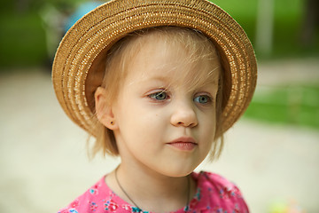 Image showing Cute kid girl wearing hat outdoors