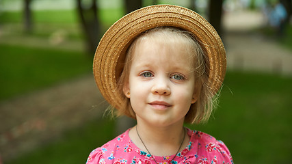 Image showing Cute kid girl wearing hat outdoors