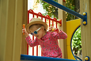 Image showing Portrait of laughing little girl in stawn hat