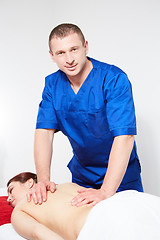 Image showing Young woman having back massage.