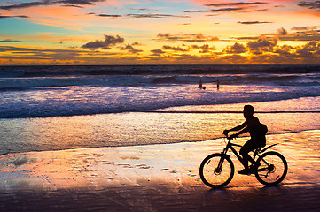 Image showing Cycling on the beach, silhouette