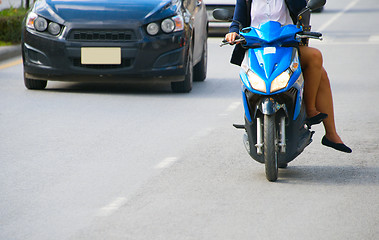 Image showing Women riding a sccoter