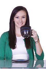 Image showing  Teenager Drinking Coffee While Working on the Computer