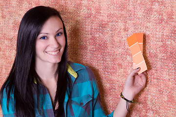 Image showing Girl Choosing a Color for the Walls