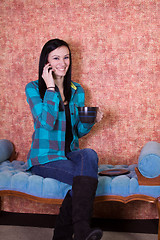 Image showing Teenager Drinking Coffee and Talking On the Phone