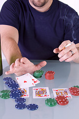 Image showing Man Going all in with Royal Flush