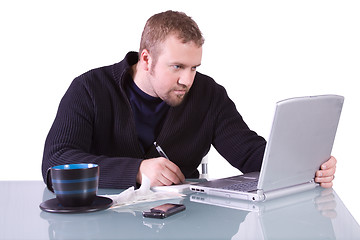 Image showing Young Casual Businessman Working at his Desk