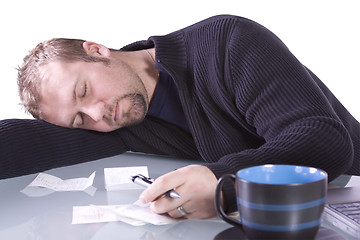 Image showing Young Casual Businessman Sleeping at his Desk