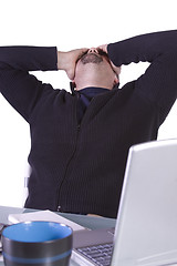 Image showing Frustrated Young Casual Businessman Working at his Desk