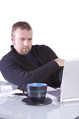 Image showing Young Casual Businessman Working at his Desk