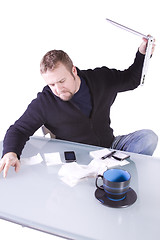 Image showing Frustrated Young Casual Businessman Working at his Desk