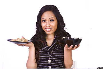 Image showing Beautiful Girl Deciding What to Eat