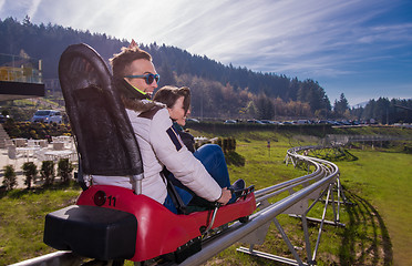 Image showing couple driving on alpine coaster